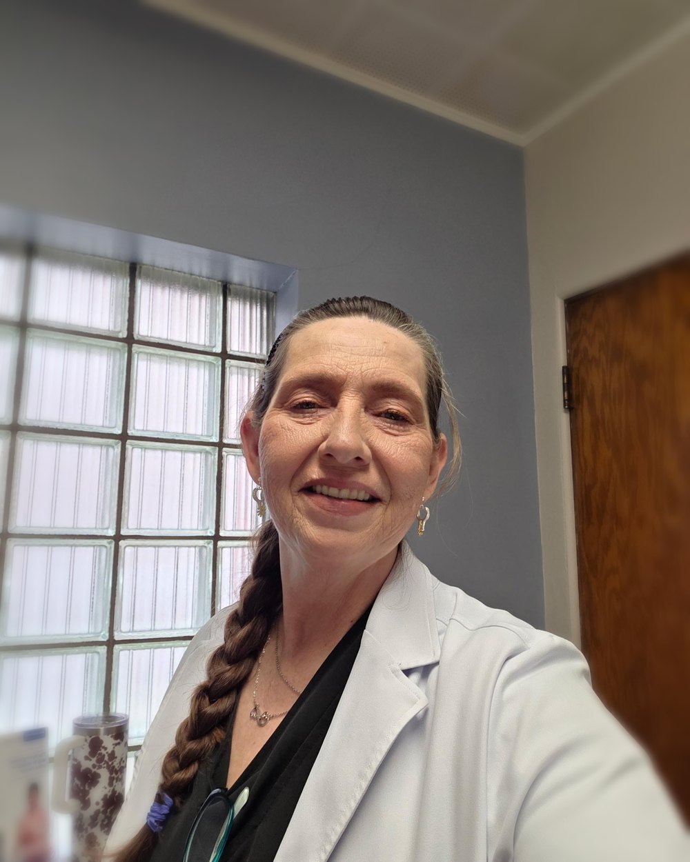 Mary Bratcher, founder of PulsePoint Mobile, in her white coat
