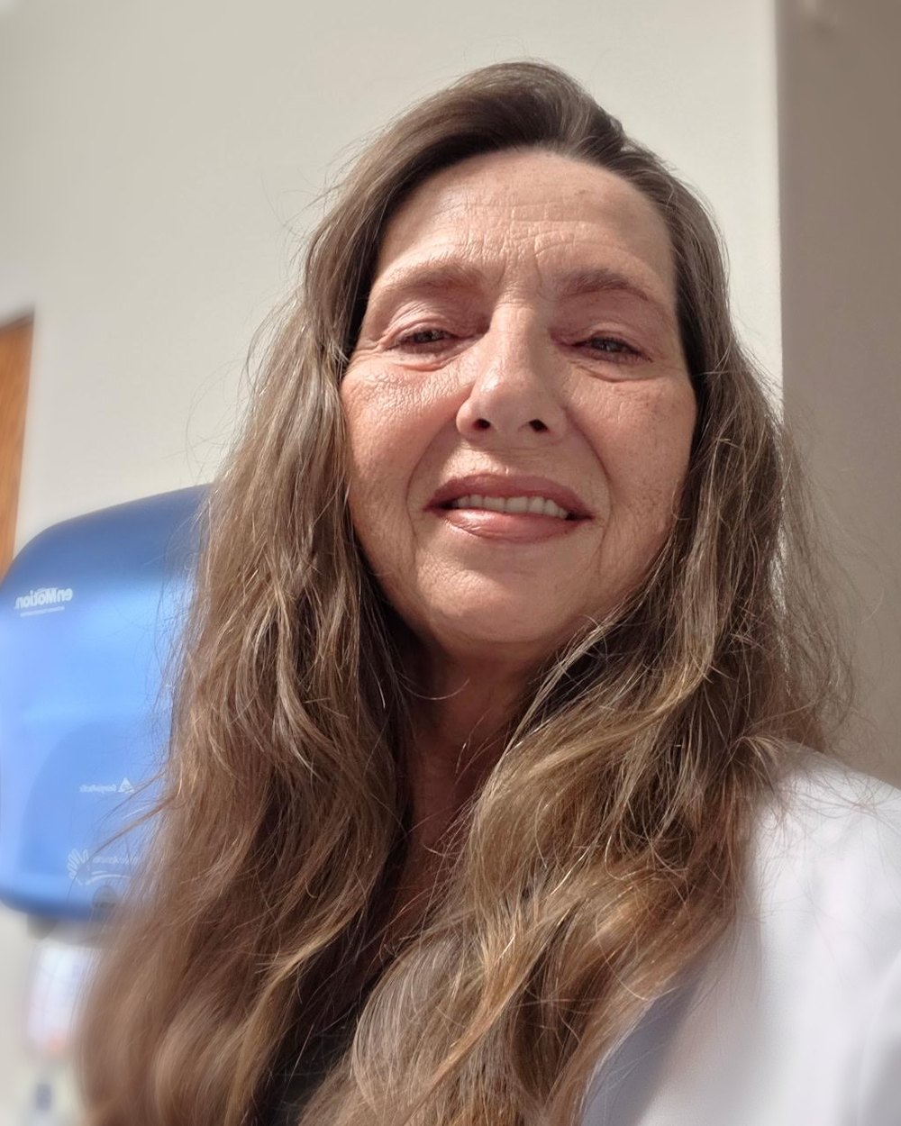 Mary Bratcher in her white coat at a client office